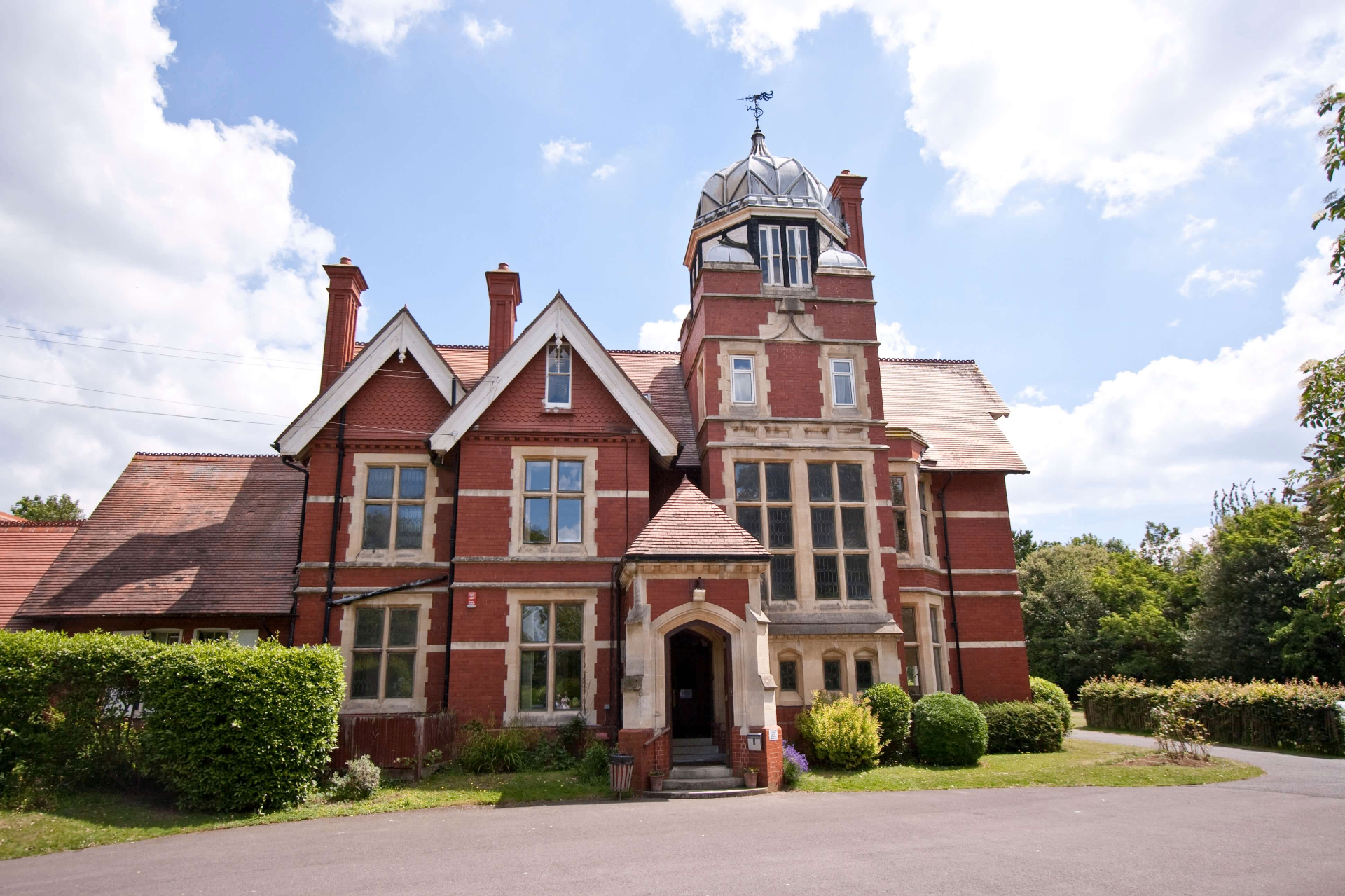 Landscaped garden and outdoor seating area at Loxdale English Centre